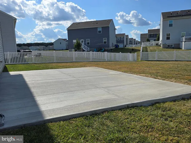 a view of a swimming pool with a yard