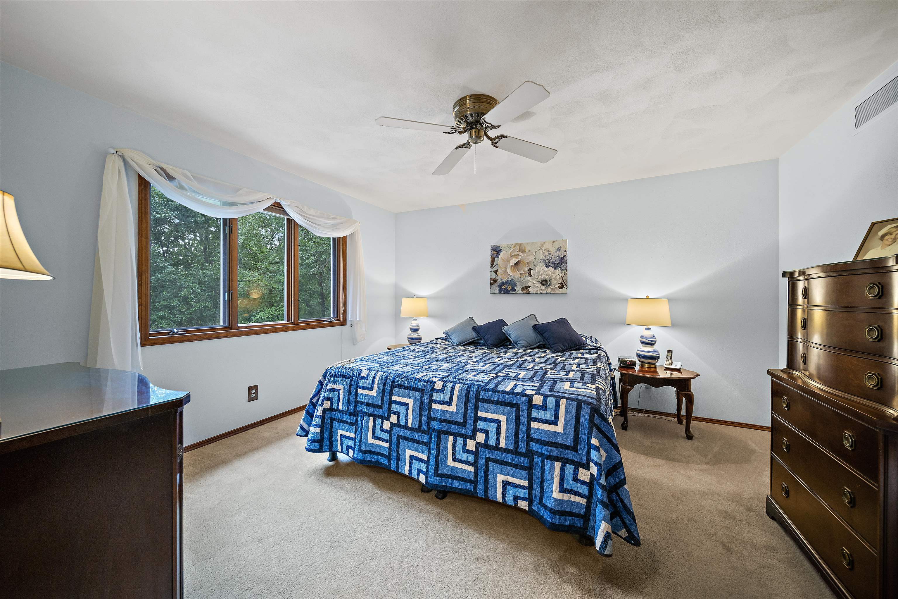 692 Sioux Drive Freeport, IL 61032 - Photo 16 of 36 a bedroom with a bed and wooden floor