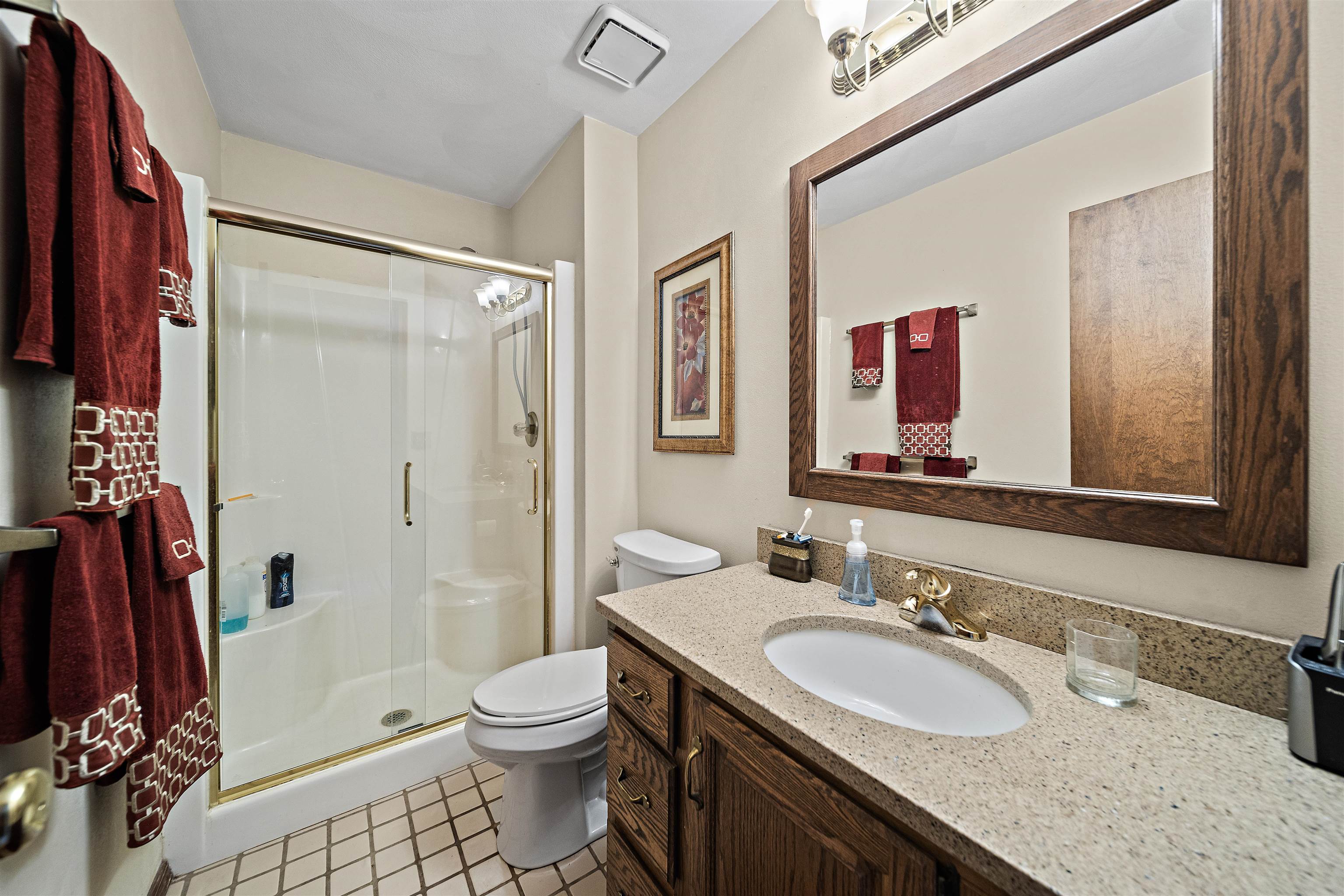 692 Sioux Drive Freeport, IL 61032 - Photo 17 of 36 a bathroom with a granite countertop sink toilet and shower