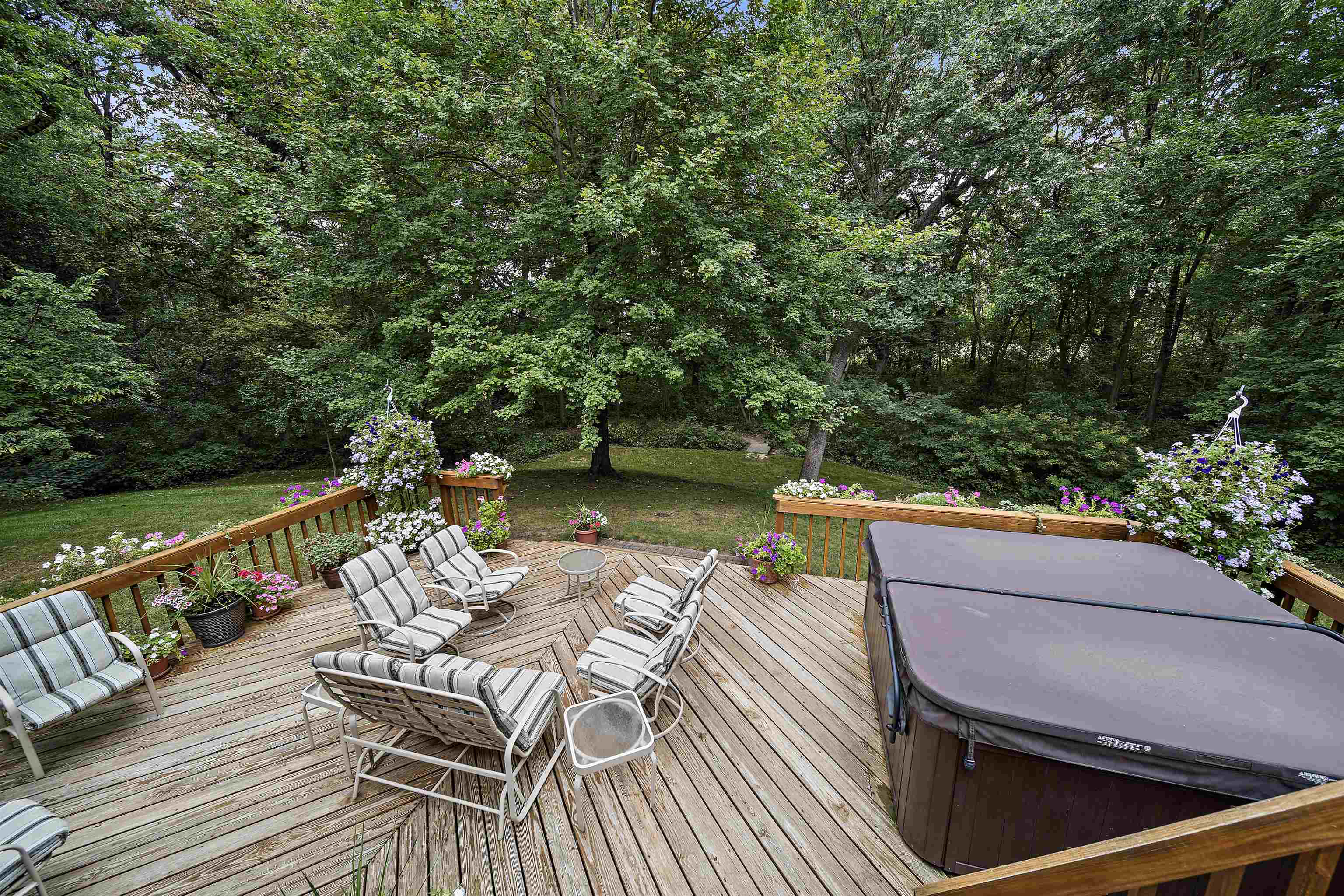 692 Sioux Drive Freeport, IL 61032 - Photo 30 of 36 a view of a balcony with two chairs and a wooden floor