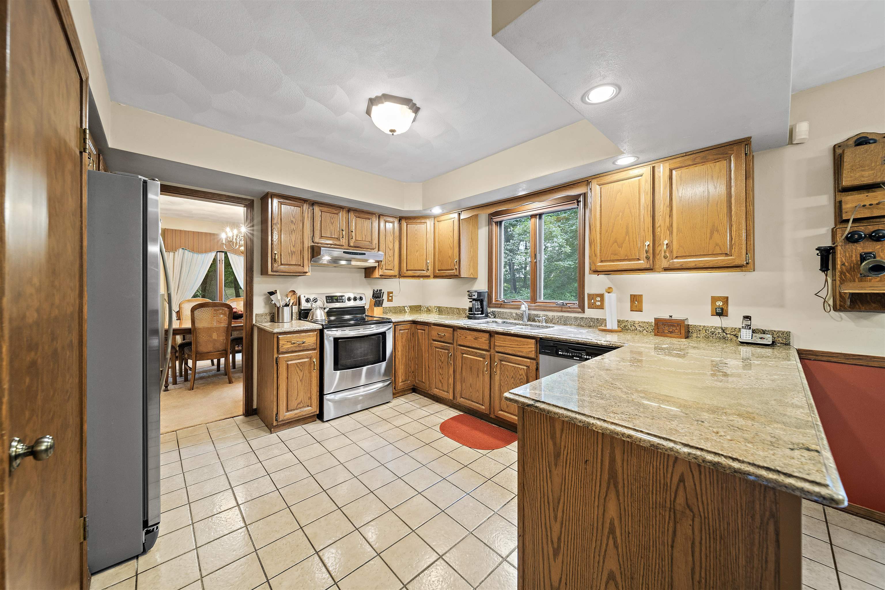 692 Sioux Drive Freeport, IL 61032 - Photo 7 of 36 a kitchen with a sink window and cabinets