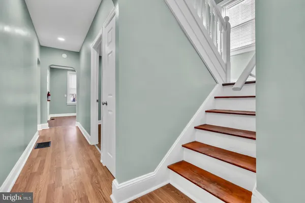 a view of entryway with wooden floor