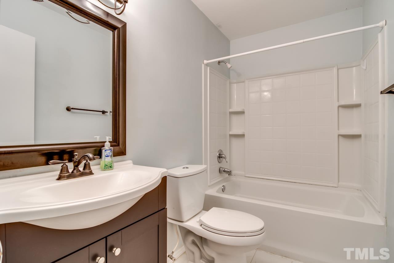 17 Prestwick Place, Unit 17 Durham, NC 27705 - Photo 14 of 27 a bathroom with a sink toilet vanity and shower