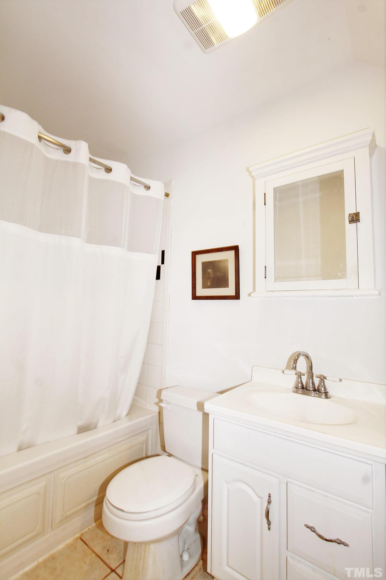 17 Prestwick Place, Unit 17 Durham, NC 27705 - Photo 27 of 27 a white toilet sitting next to a bathroom sink