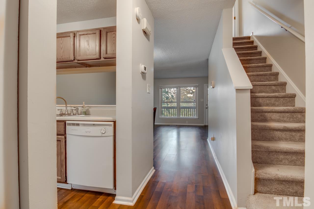 17 Prestwick Place, Unit 17 Durham, NC 27705 - Photo 4 of 27 a view of a hallway with wooden floor and entryway