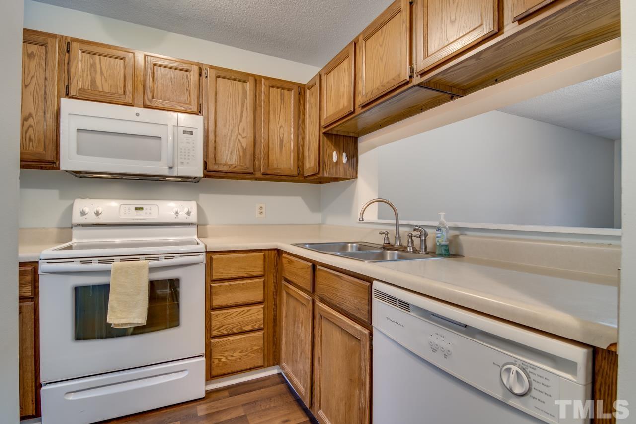 17 Prestwick Place, Unit 17 Durham, NC 27705 - Photo 5 of 27 a kitchen with a stove microwave and sink