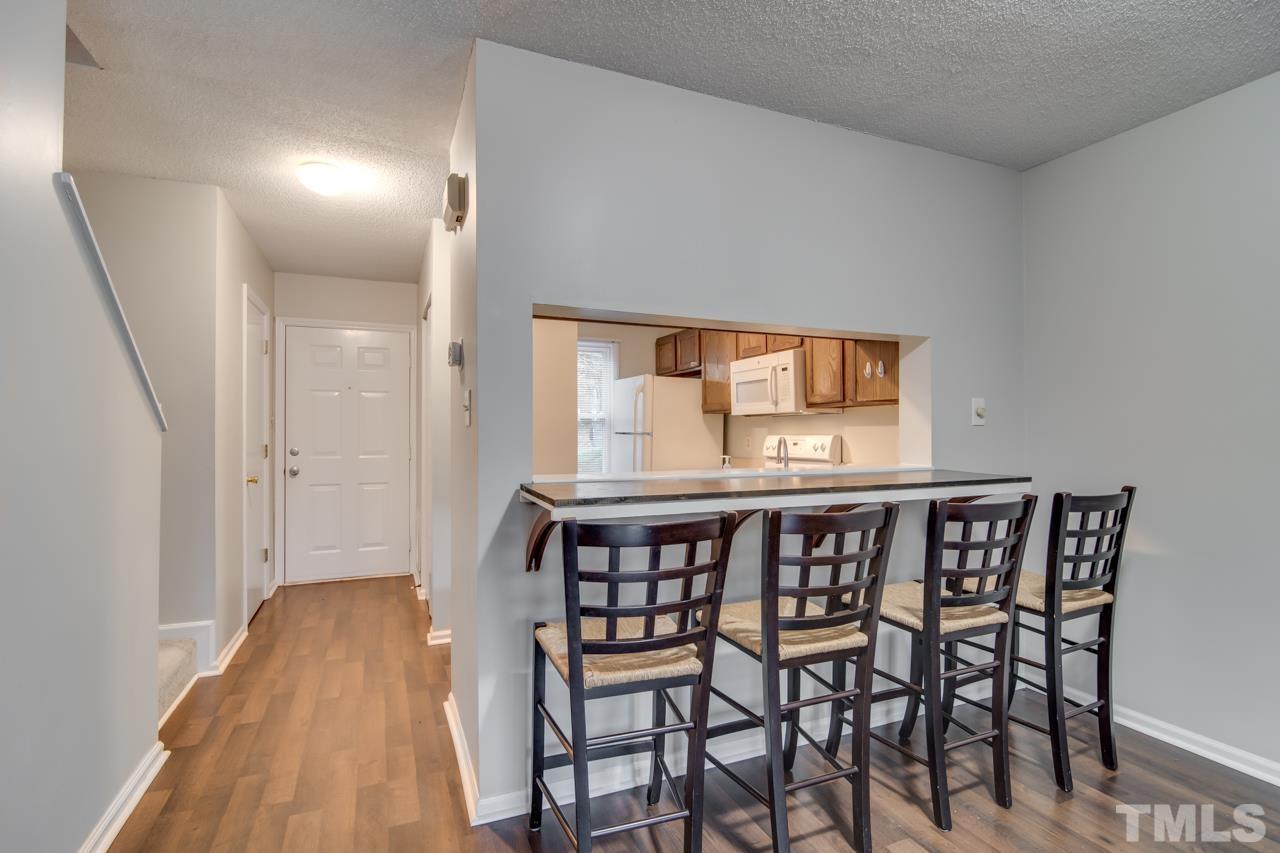 17 Prestwick Place, Unit 17 Durham, NC 27705 - Photo 8 of 27 a view of a dining room with furniture and wooden floor