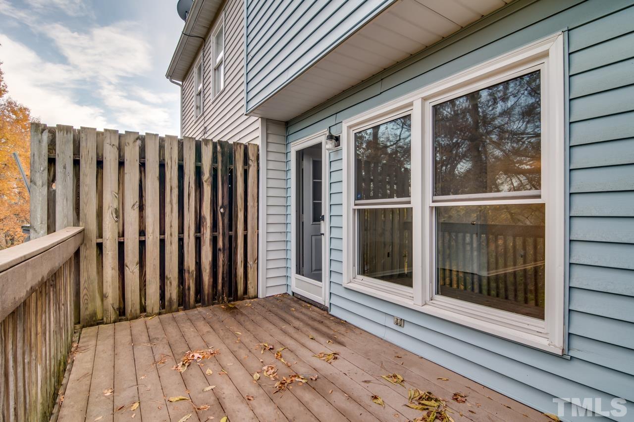 17 Prestwick Place, Unit 17 Durham, NC 27705 - Photo 10 of 27 a view of a backyard with wooden floor and iron stairs
