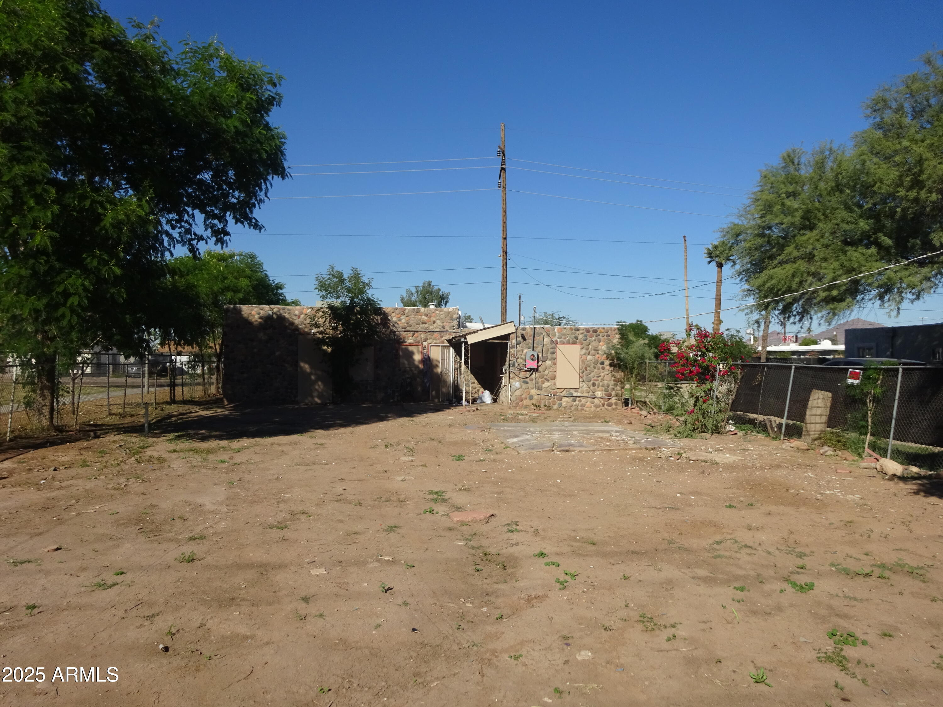 2821 East Adams Street Phoenix, AZ 85034 - Photo 14 of 17 a street view with flat screen tv