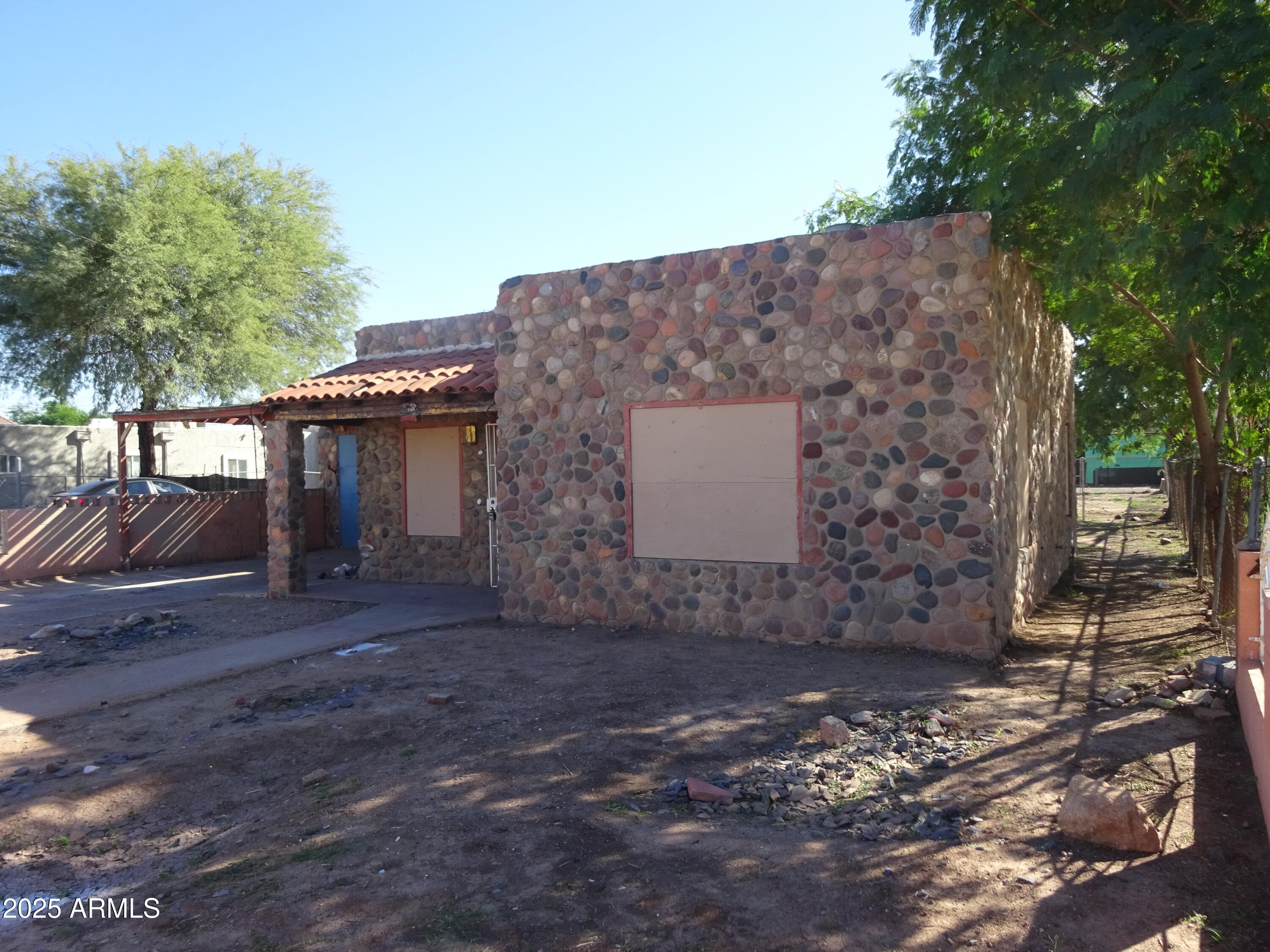 2821 East Adams Street Phoenix, AZ 85034 - Photo 8 of 17 a view of a house with a yard