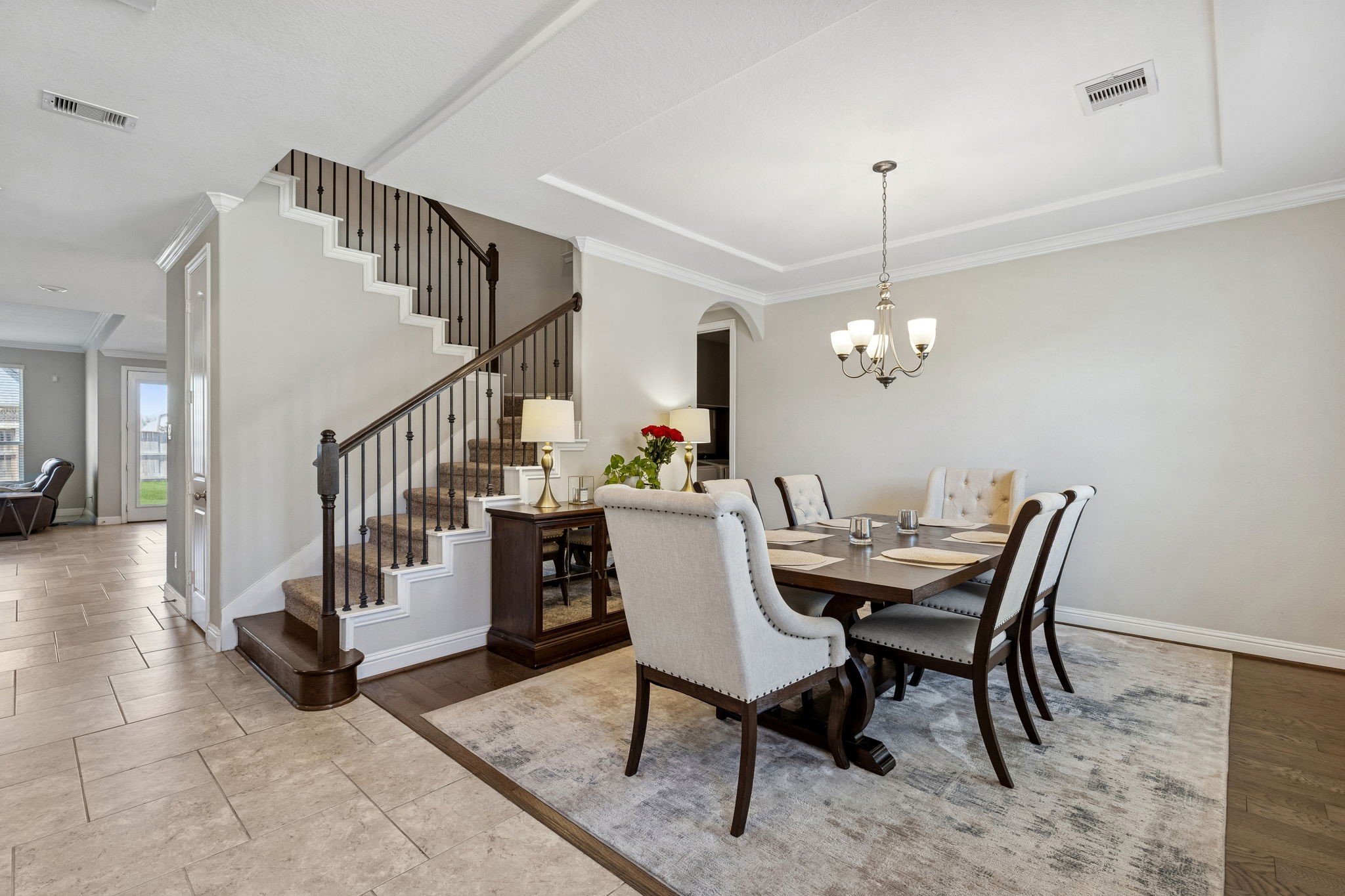 1619 Dove Ridge Drive Katy, TX 77493 - Photo 2 of 28 Host elegant dinners in this formal dining area featuring crown molding and engineered wood flooring. The space is perfectly positioned off the entry, offering a sophisticated first impression for your guests.
