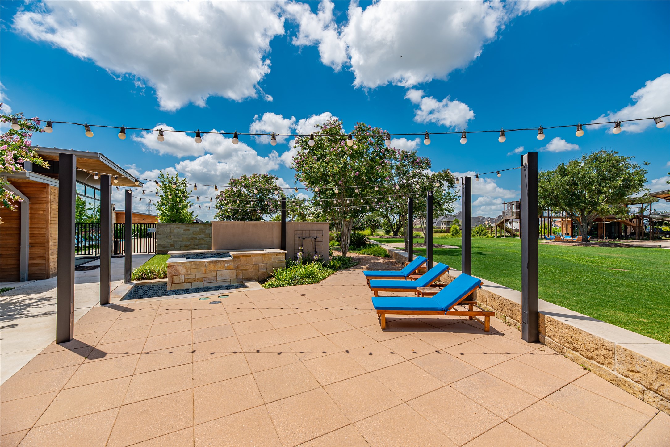 1619 Dove Ridge Drive Katy, TX 77493 - Photo 25 of 28 Part of Cane Island’s vibrant Cane Quarter amenity village, this resort-style gathering space offers poolside lounging, cabanas, and open areas for residents to relax, play, and connect — just one of many lifestyle-driven amenities in this premier master-planned community in Katy, Texas.