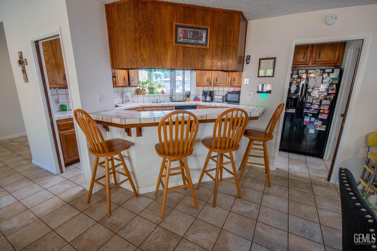 Undisclosed Address Bakersfield, CA 93309 - Photo 13 of 46 a dining room with furniture and window
