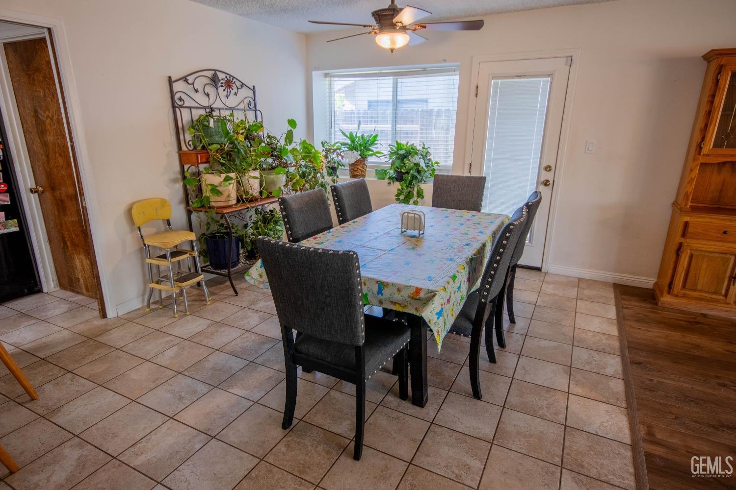 Undisclosed Address Bakersfield, CA 93309 - Photo 18 of 46 a view of a dining room with furniture