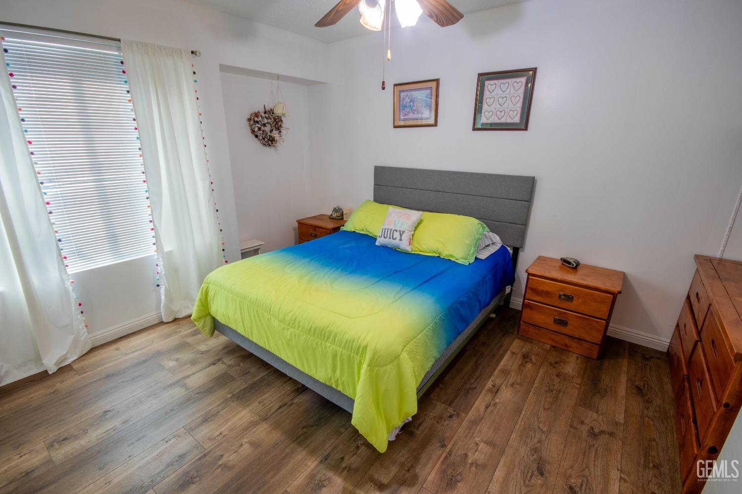 Undisclosed Address Bakersfield, CA 93309 - Photo 27 of 46 a bed sitting in a bedroom next to a window