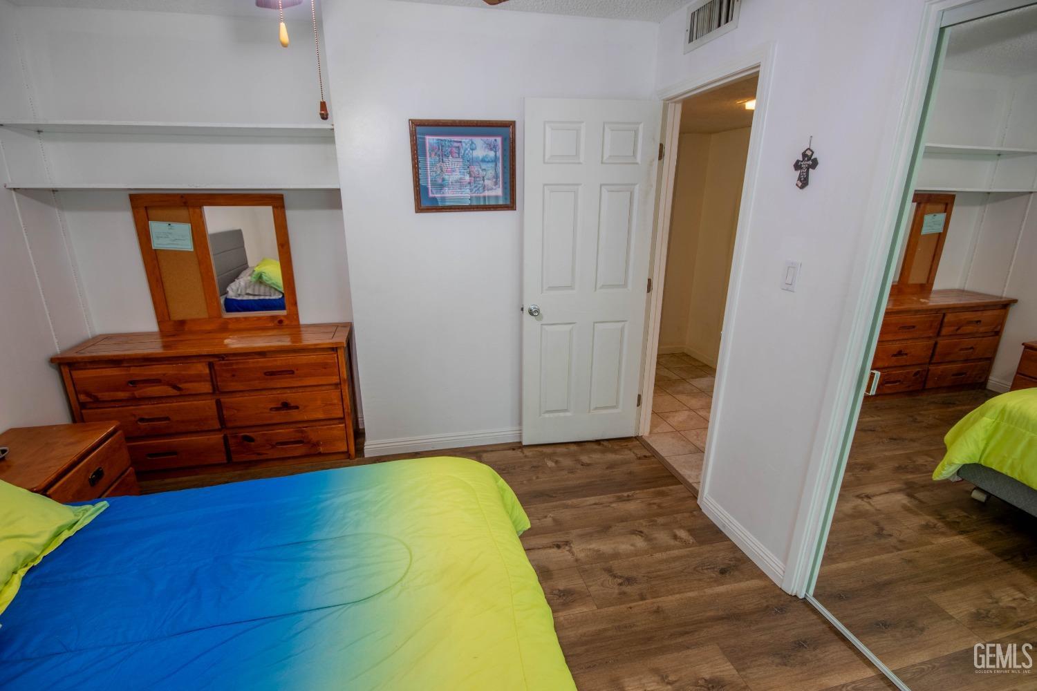 Undisclosed Address Bakersfield, CA 93309 - Photo 28 of 46 a bedroom with a bed and furniture