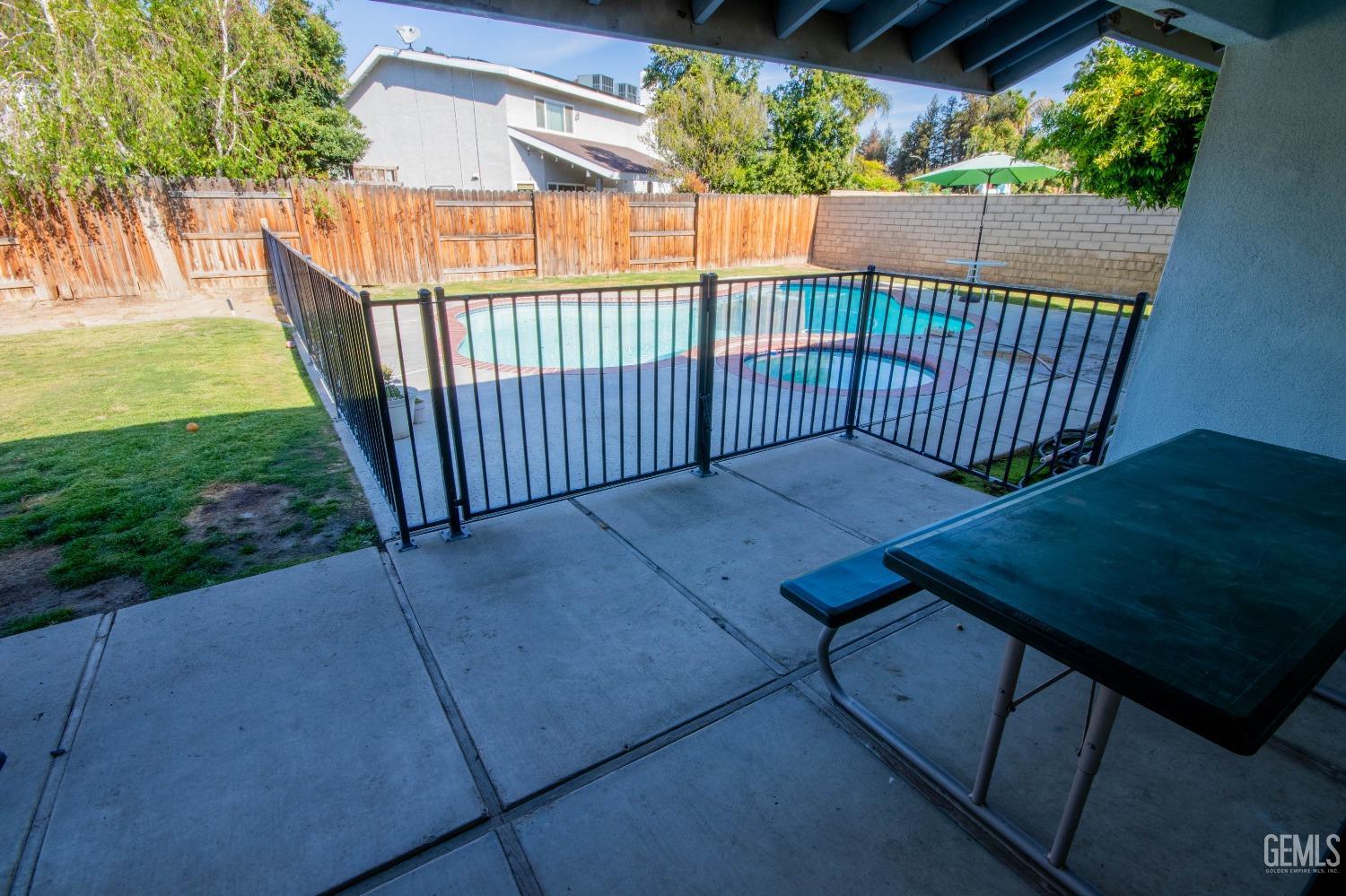 Undisclosed Address Bakersfield, CA 93309 - Photo 33 of 46 a view of backyard with outdoor seating and green space