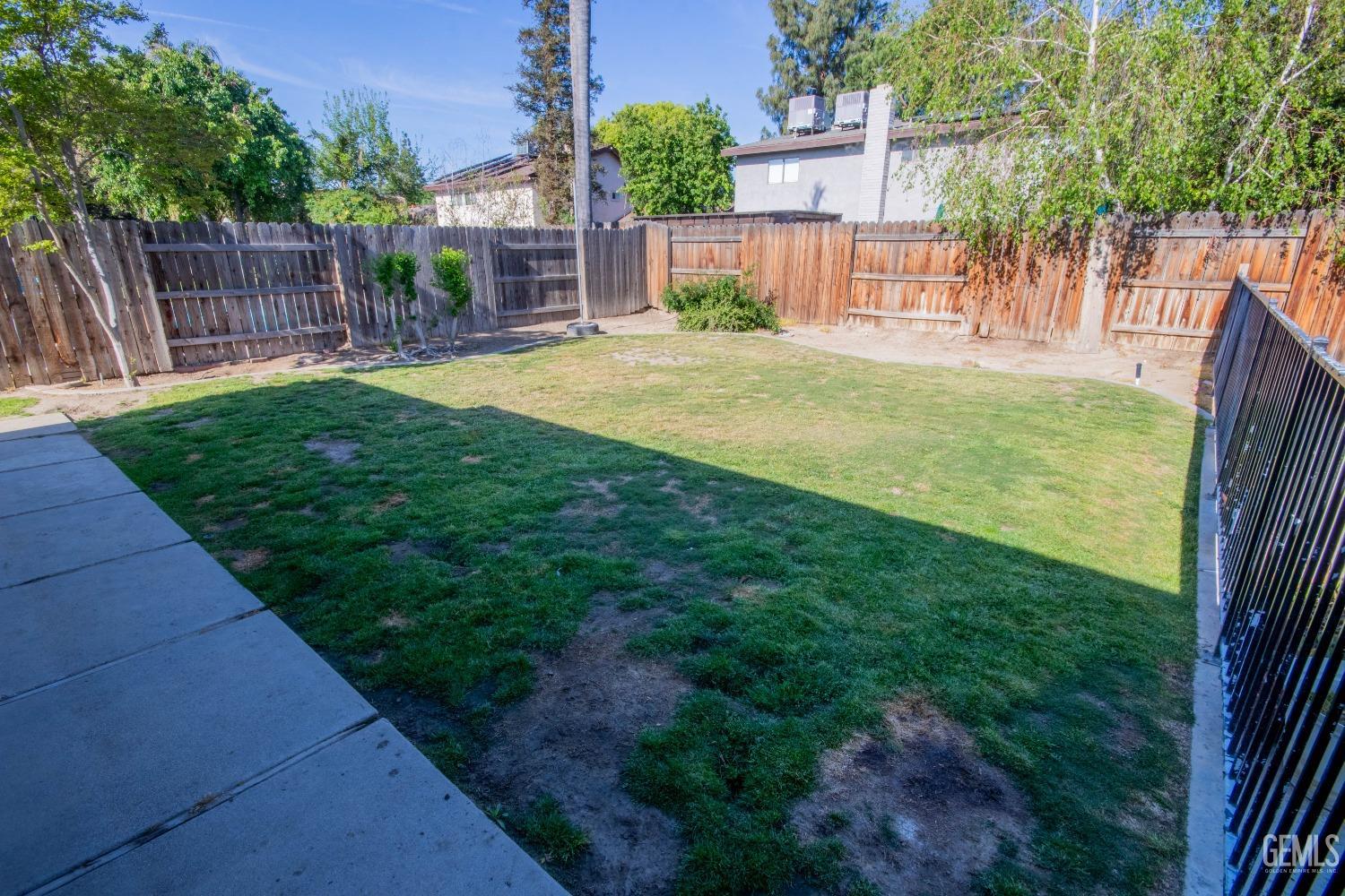 Undisclosed Address Bakersfield, CA 93309 - Photo 38 of 46 a view of a backyard with a garden and plants