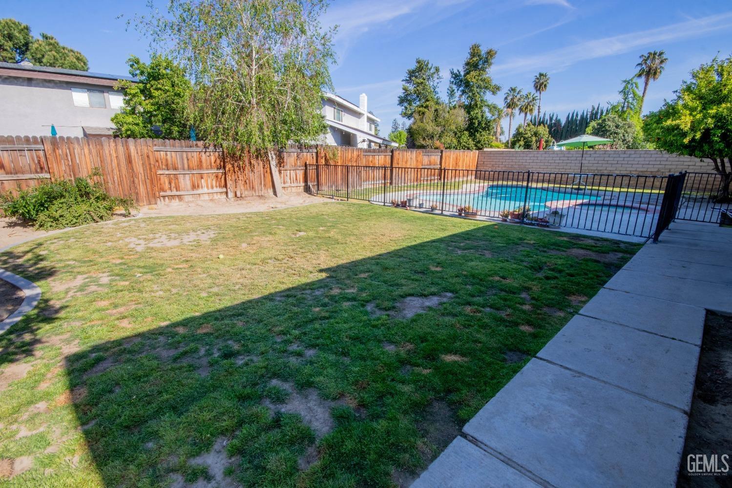 Undisclosed Address Bakersfield, CA 93309 - Photo 39 of 46 a view of a backyard with a garden