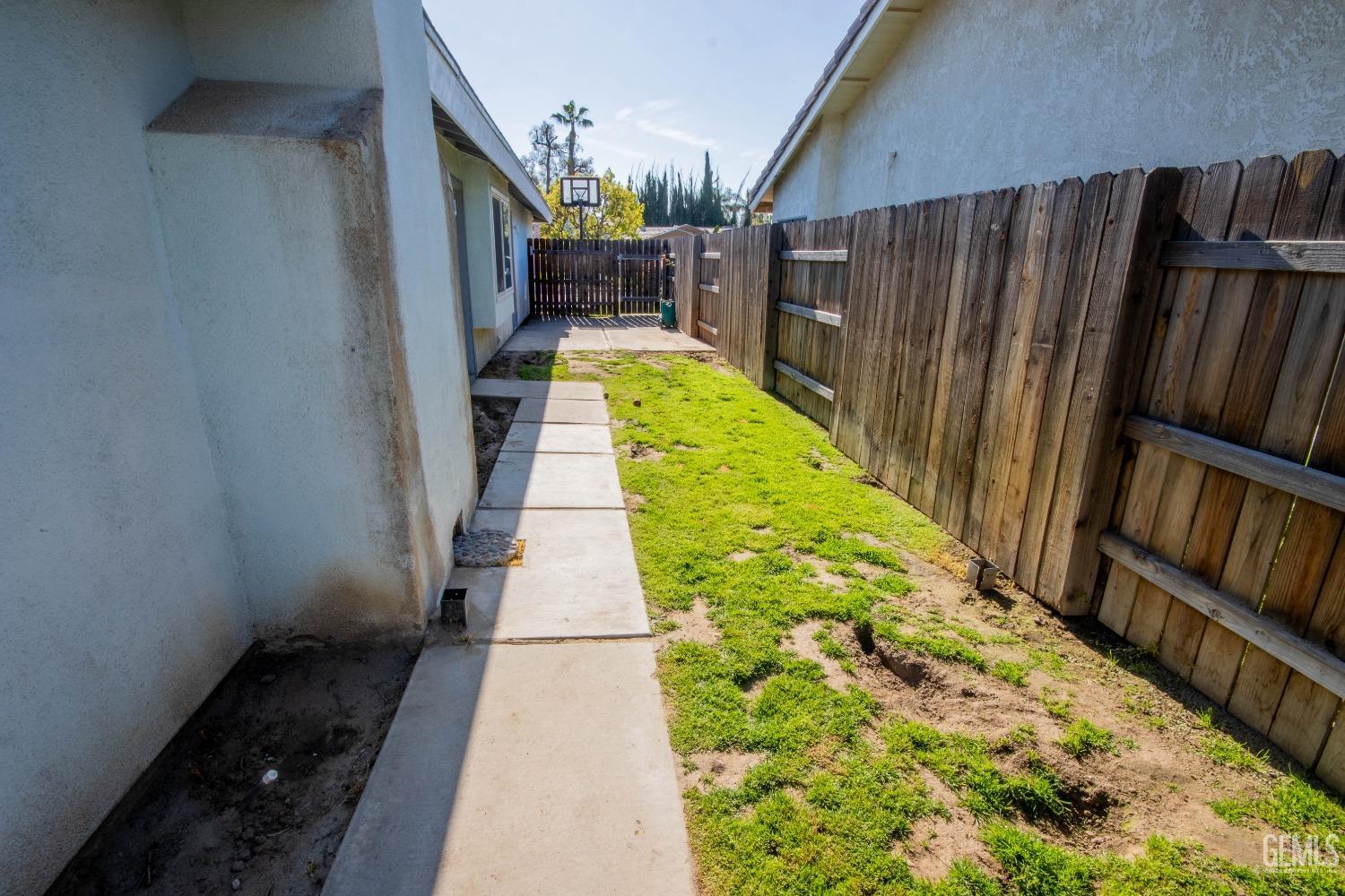 Undisclosed Address Bakersfield, CA 93309 - Photo 41 of 46 a view of a backyard with wooden fence