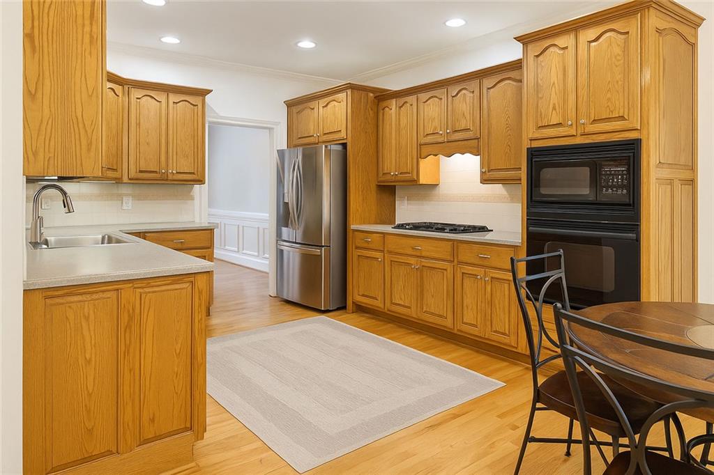 2014 Hubbard Court Villa Rica, GA 30180 - Photo 15 of 41 a kitchen with stainless steel appliances granite countertop a refrigerator and a sink