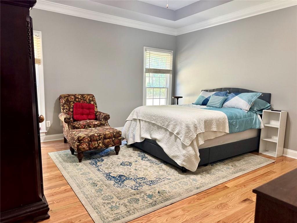 2014 Hubbard Court Villa Rica, GA 30180 - Photo 23 of 41 a bedroom with a bed and wooden floor