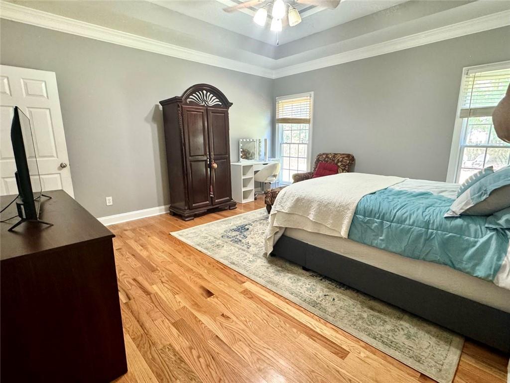 2014 Hubbard Court Villa Rica, GA 30180 - Photo 24 of 41 a spacious bedroom with a bed a dresser and a window