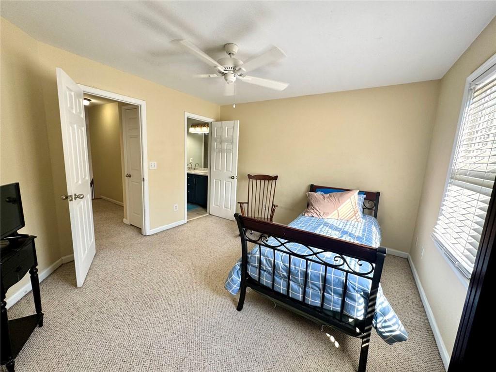 2014 Hubbard Court Villa Rica, GA 30180 - Photo 32 of 41 a spacious bedroom with a bed and a window