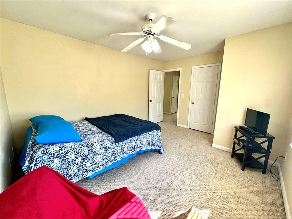 2014 Hubbard Court Villa Rica, GA 30180 - Photo 34 of 41 a bedroom with a bed and wooden floor