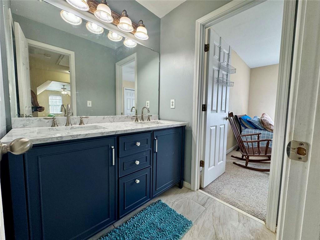 2014 Hubbard Court Villa Rica, GA 30180 - Photo 36 of 41 a en suite bathroom with a double vanity sink and a mirror