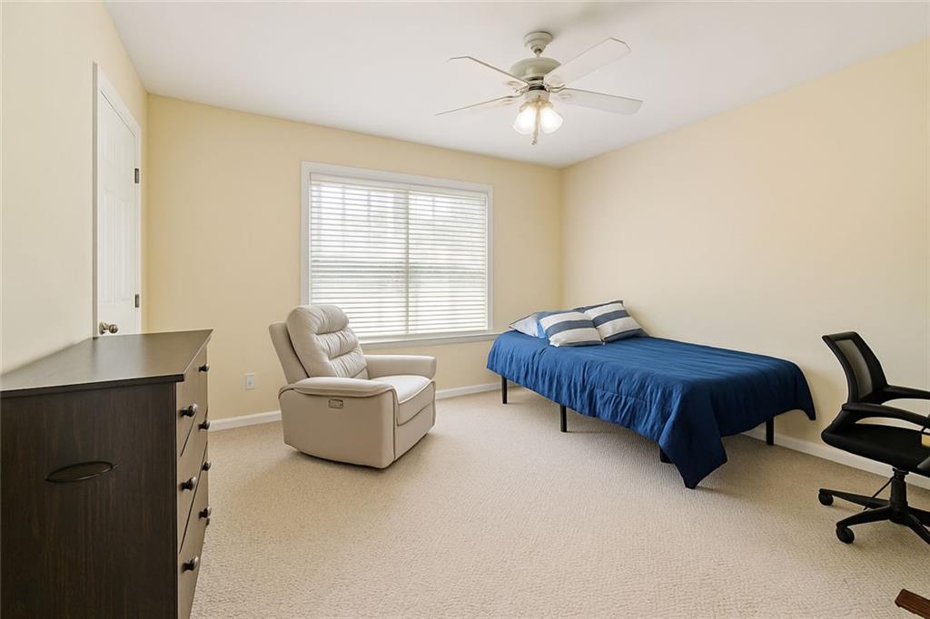 2014 Hubbard Court Villa Rica, GA 30180 - Photo 37 of 41 a bedroom with a bed couch and window