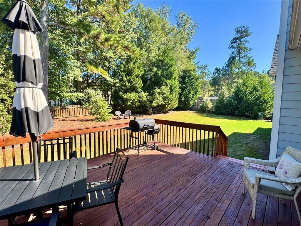 2014 Hubbard Court Villa Rica, GA 30180 - Photo 39 of 41 a view of a wooden deck with a bench