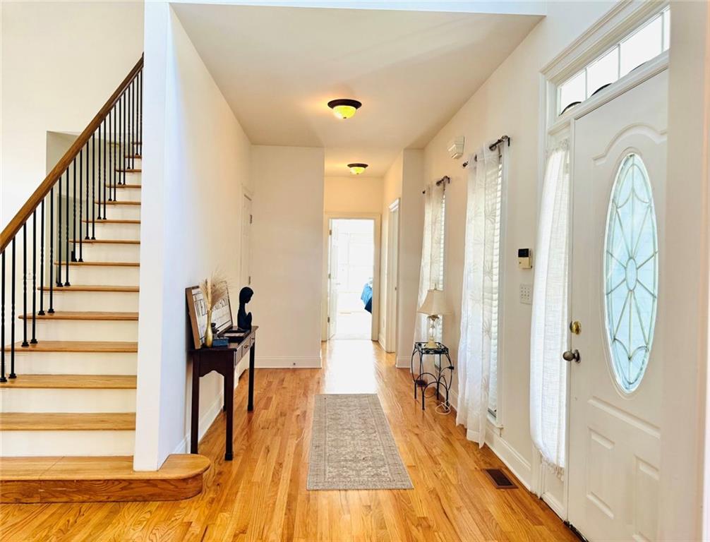 2014 Hubbard Court Villa Rica, GA 30180 - Photo 7 of 41 a view of a hallway with wooden floor and staircase