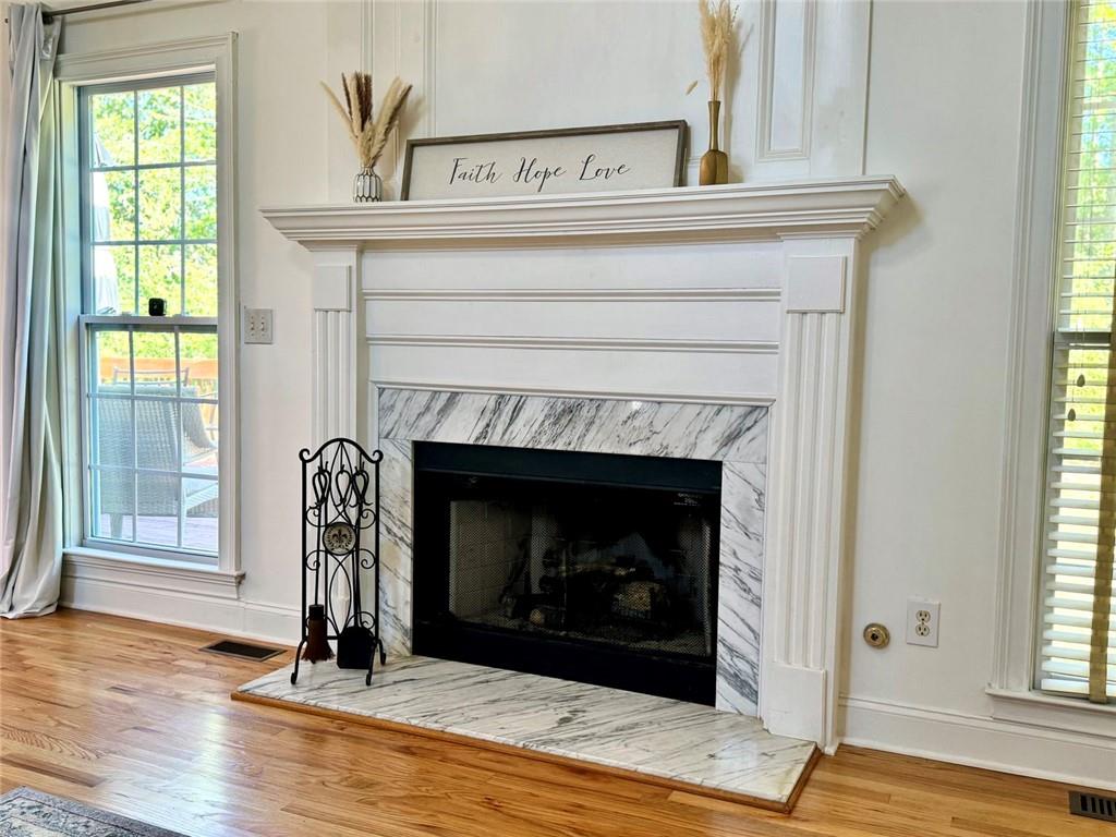 2014 Hubbard Court Villa Rica, GA 30180 - Photo 10 of 41 a living room with a fireplace and windows