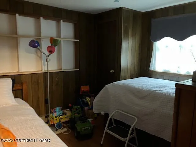 a bedroom with a bed and a closet