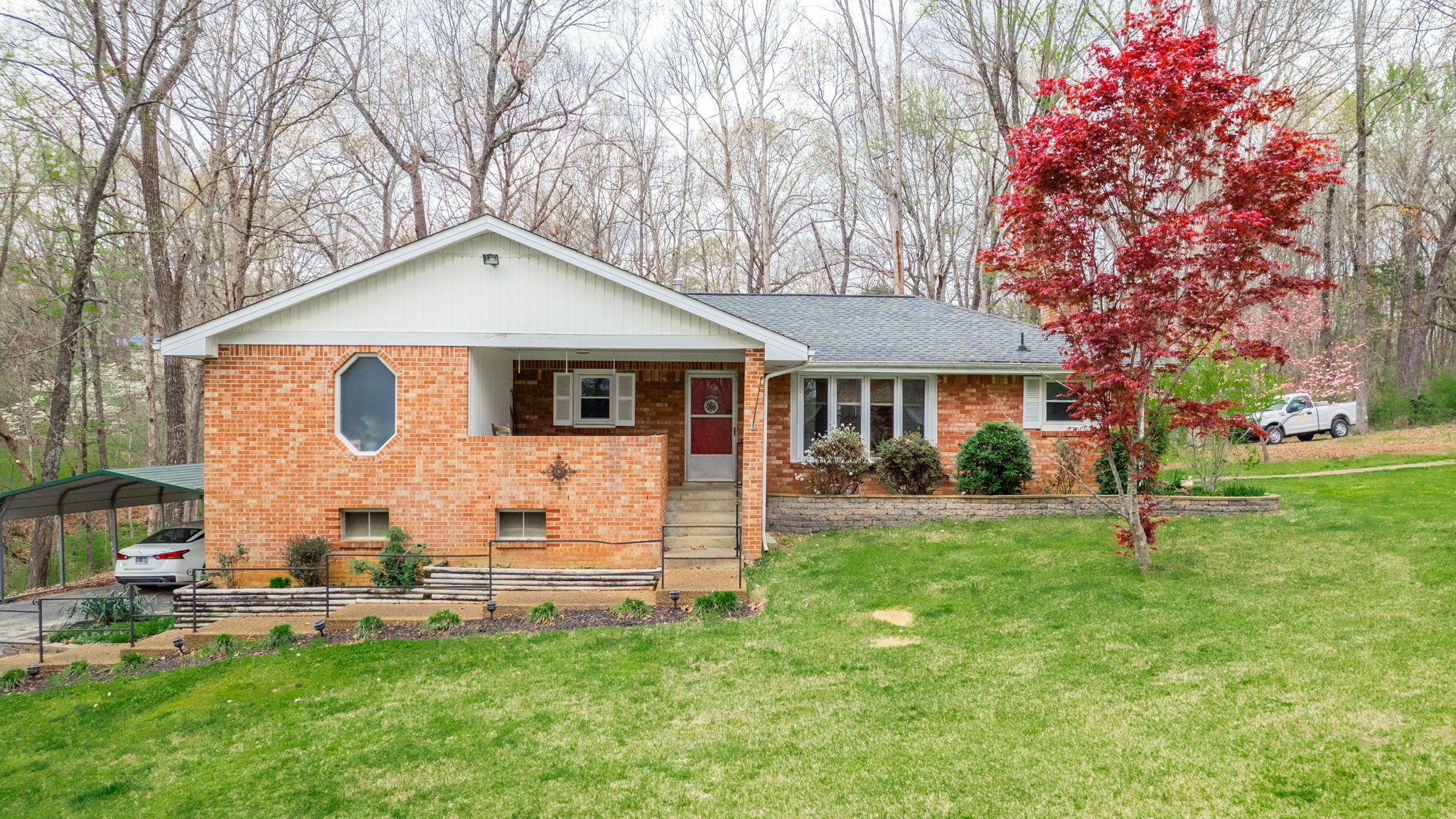 a front view of a house with a yard