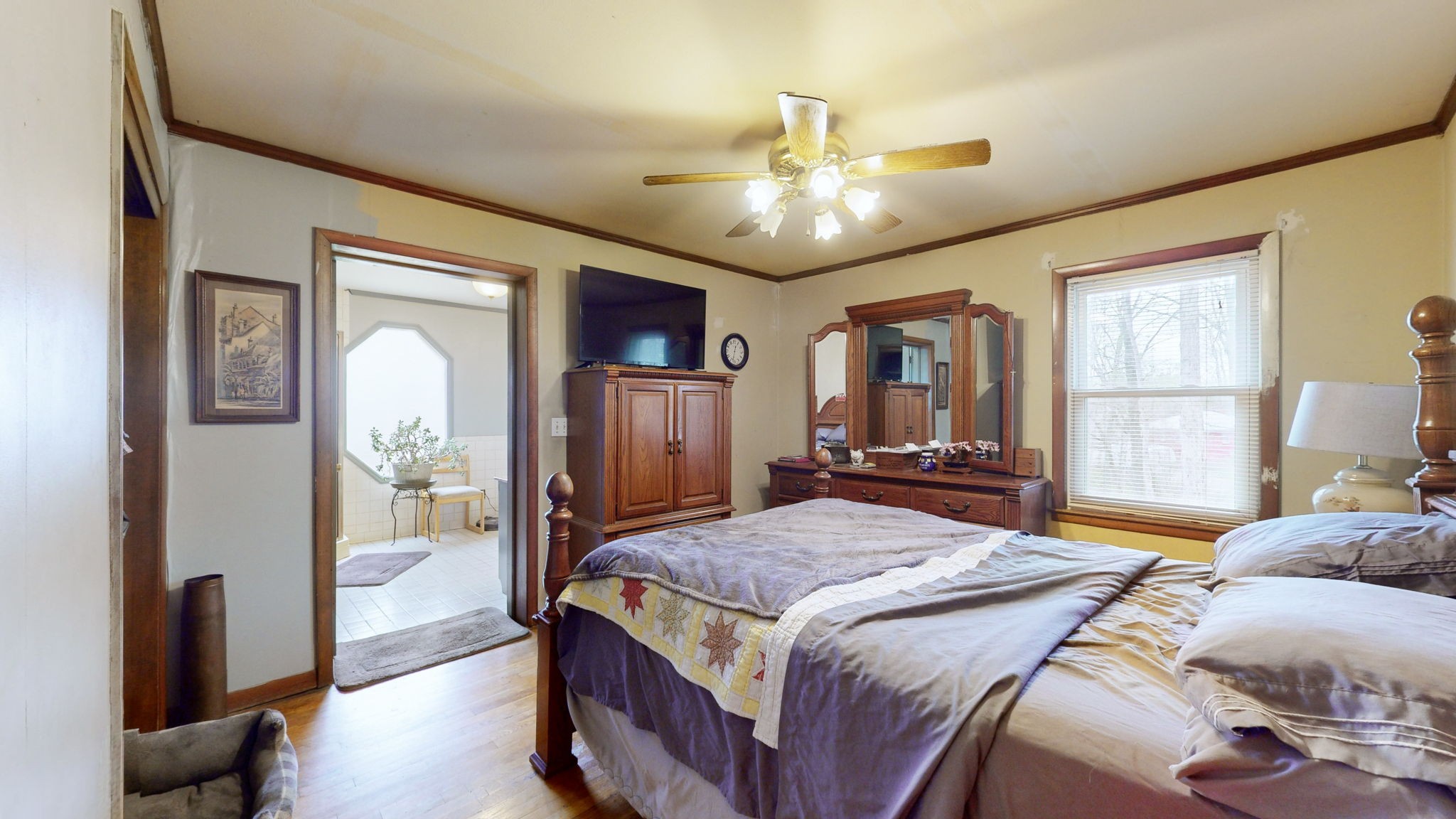 209 Bellwood Circle Dickson, TN 37055 - Photo 19 of 53 a bedroom with a large bed and a chandelier