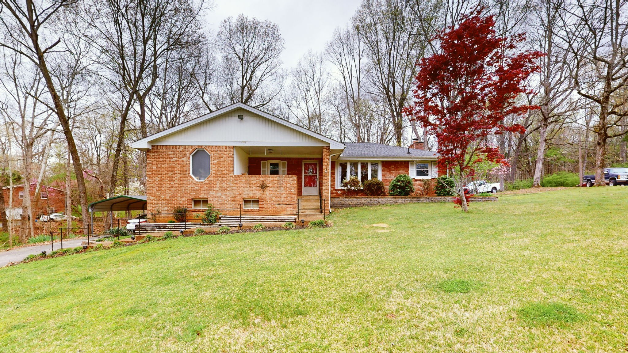 209 Bellwood Circle Dickson, TN 37055 - Photo 34 of 53 a front view of a house with a yard table and chairs
