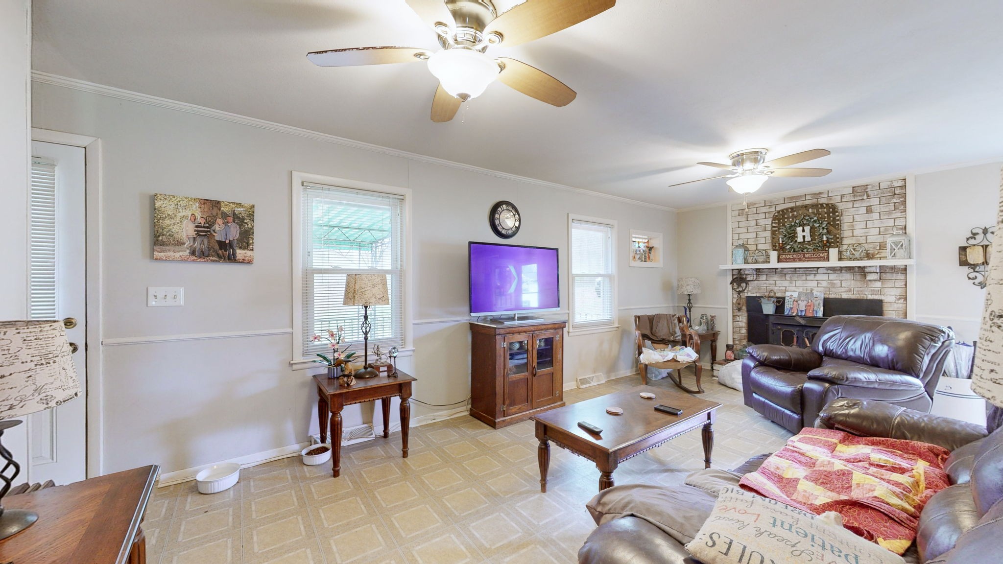 209 Bellwood Circle Dickson, TN 37055 - Photo 9 of 53 a living room with furniture a fireplace and a flat screen tv