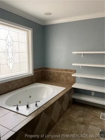 a bath tub sitting next to a window