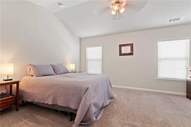 a bathroom with a bathtub a sink and a mirror
