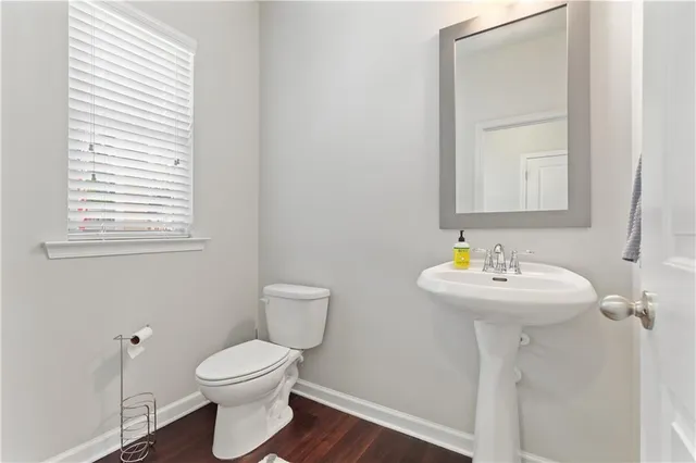 a kitchen with stainless steel appliances granite countertop wooden cabinets a stove a sink a refrigerator and a microwave