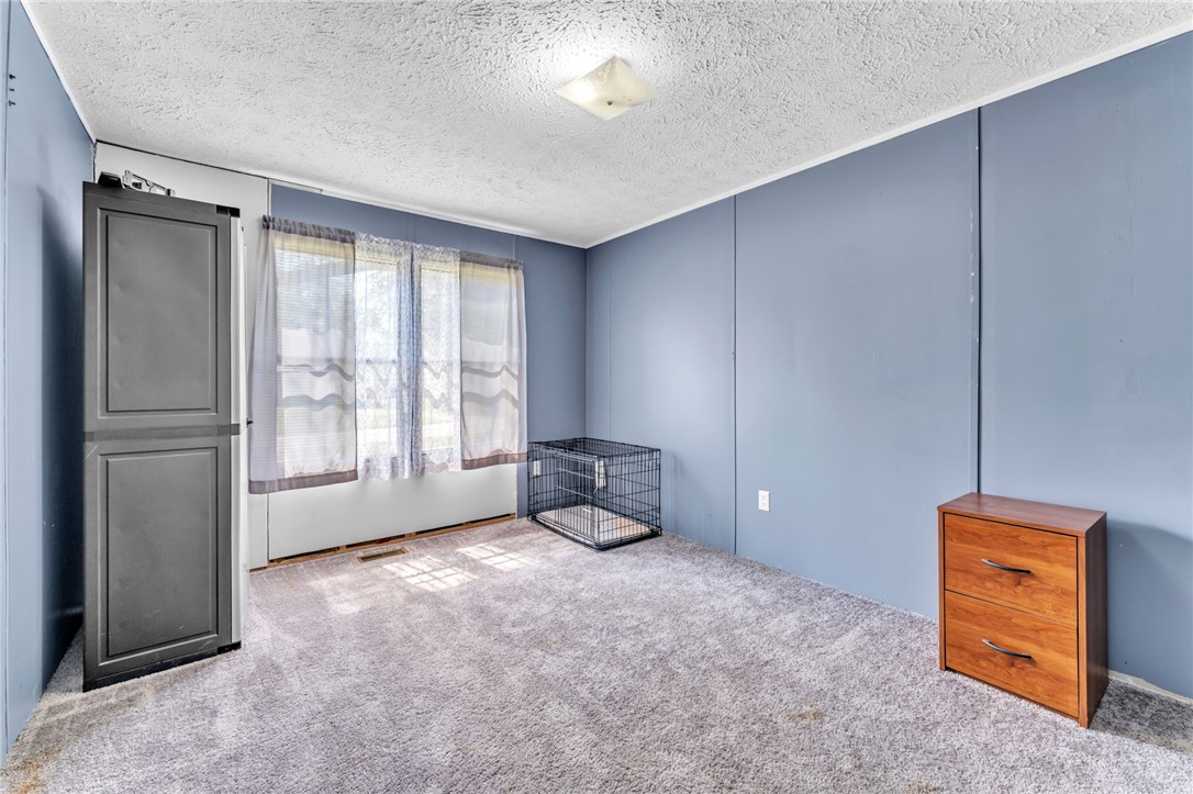137 East Reedy Fork Road Seneca, SC 29678 - Photo 20 of 28 This inviting bedroom provides a comfortable and functional living space.