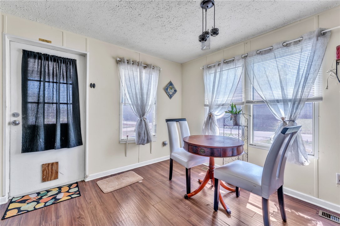 137 East Reedy Fork Road Seneca, SC 29678 - Photo 2 of 28 This bright space offers a cozy dining spot with ample natural light.