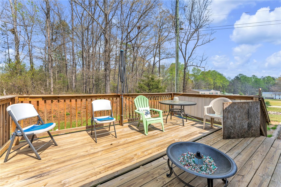 137 East Reedy Fork Road Seneca, SC 29678 - Photo 21 of 28 This spacious deck provides an ideal setting for relaxation and outdoor gatherings.