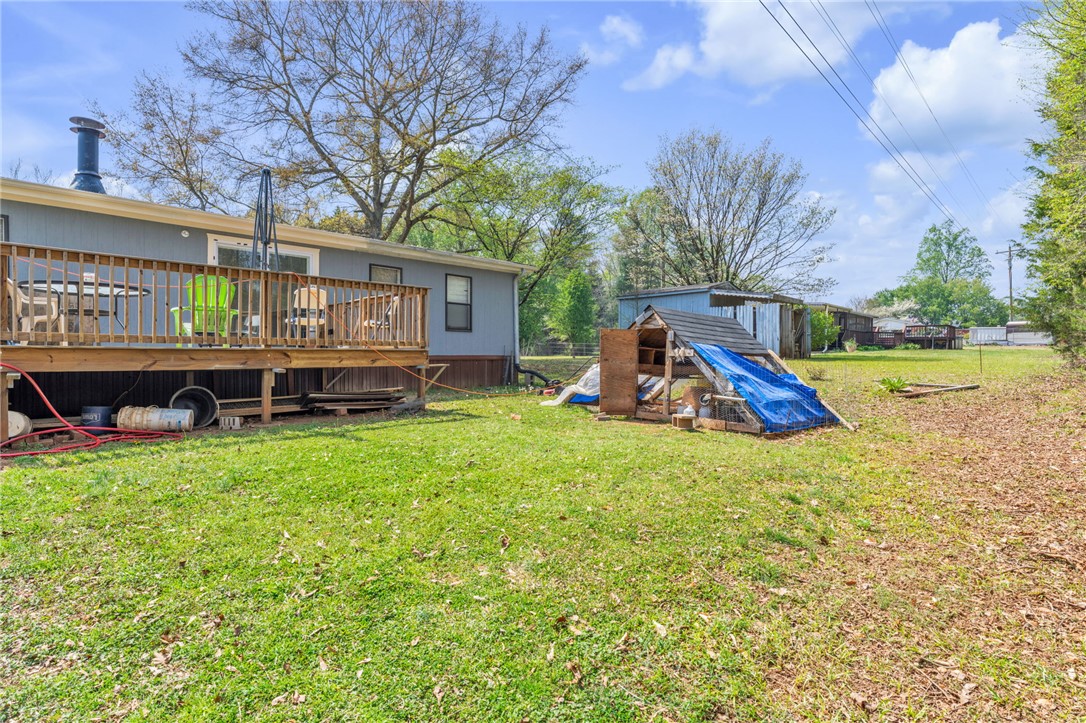 137 East Reedy Fork Road Seneca, SC 29678 - Photo 23 of 28 An inviting wood deck extends from this home, overlooking a spacious, green yard.