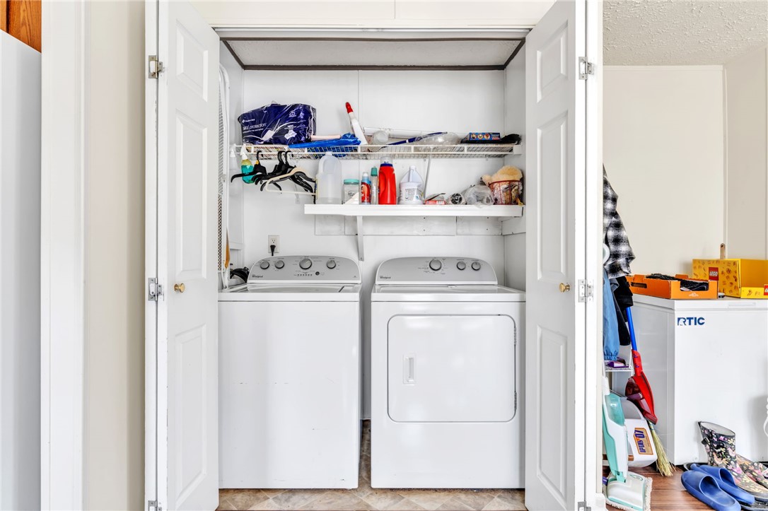 137 East Reedy Fork Road Seneca, SC 29678 - Photo 6 of 28 This dedicated laundry area features functional appliances, simplifying your daily chores with ease.