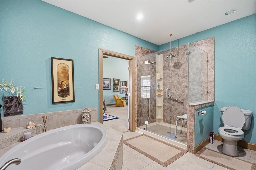 8165 Jackson Road Krum, TX 76249 - Photo 13 of 33 Primary bedroom with updated shower