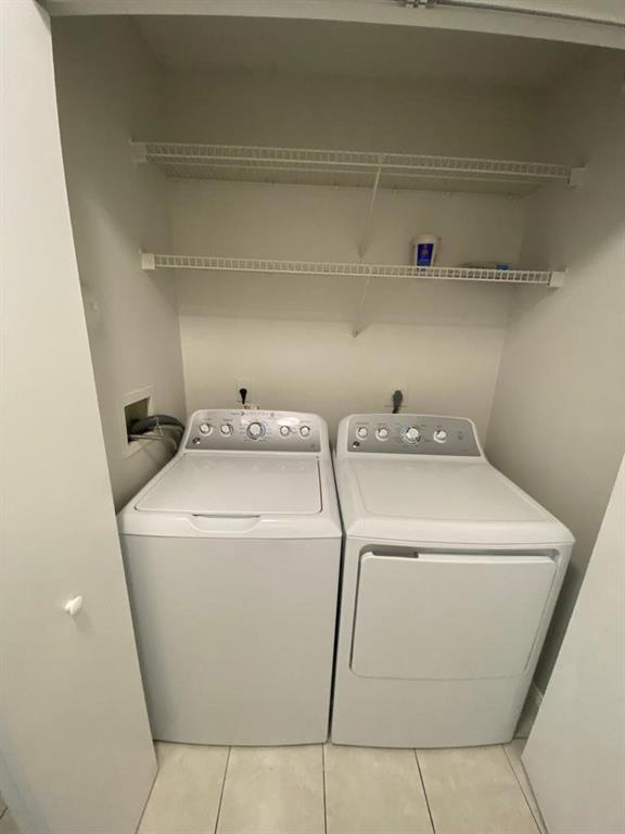 9764 Kamena Circle Boynton Beach, FL 33436 - Photo 14 of 18 a utility room with dryer and washer