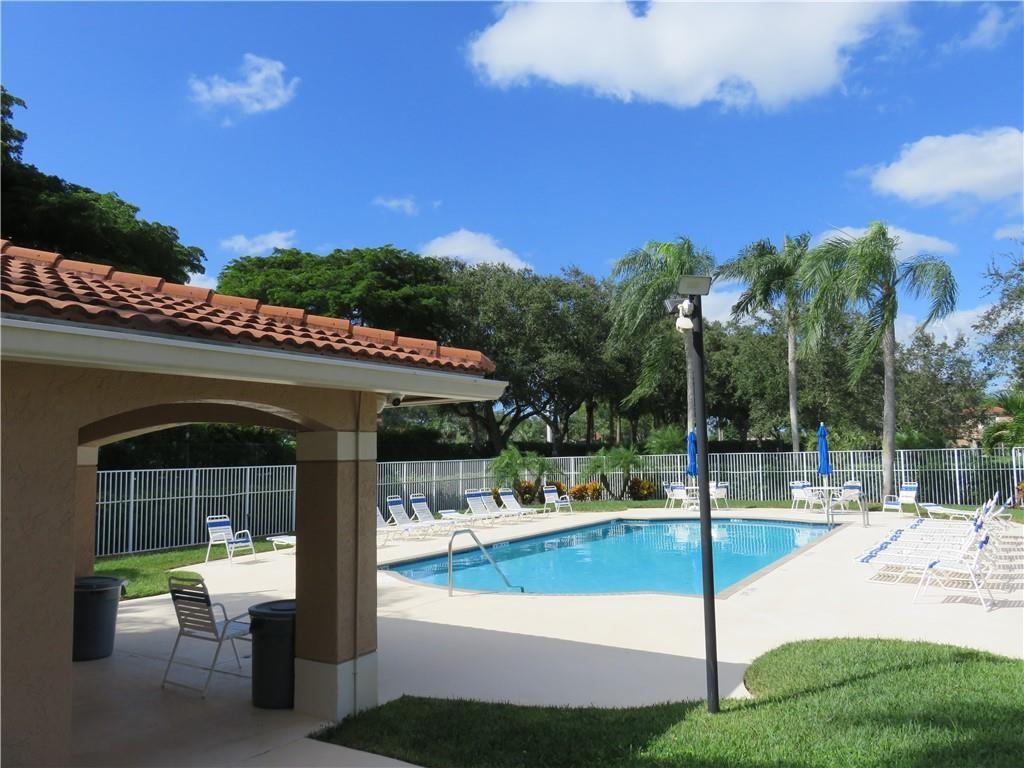 9764 Kamena Circle Boynton Beach, FL 33436 - Photo 15 of 18 a view of a patio with swimming pool